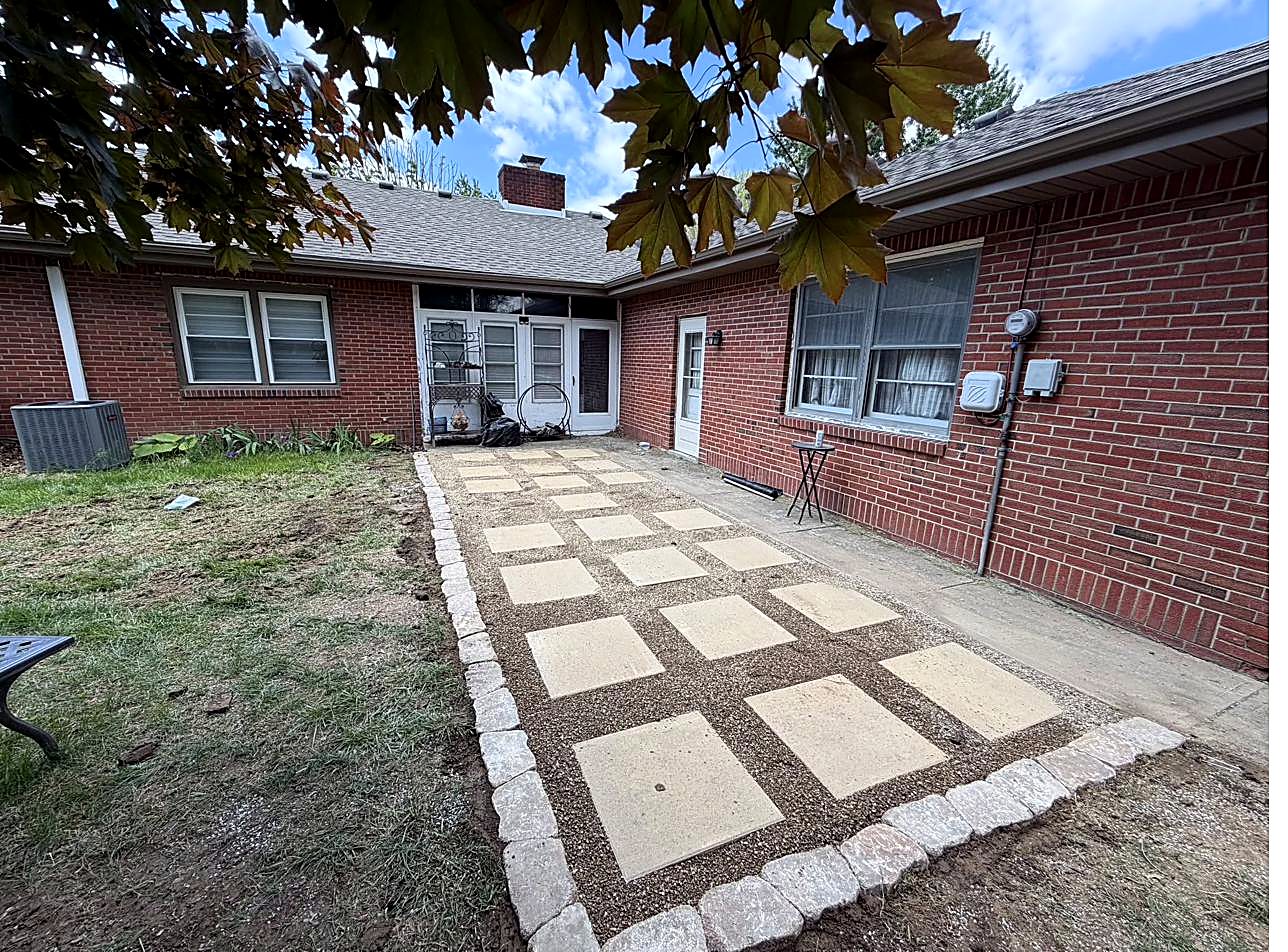 Front beds with decorative curbing and flowers